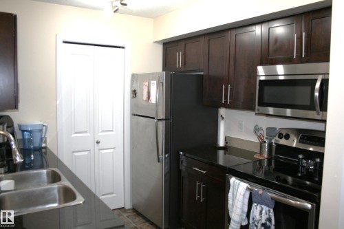308 107 Watt Common Sw, Edmonton, AB - Indoor Photo Showing Kitchen With Double Sink