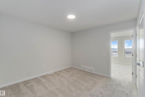 Unfurnished room featuring light colored carpet and baseboards - 262 Chappelle Drive, Edmonton, AB - Indoor Photo Showing Other Room