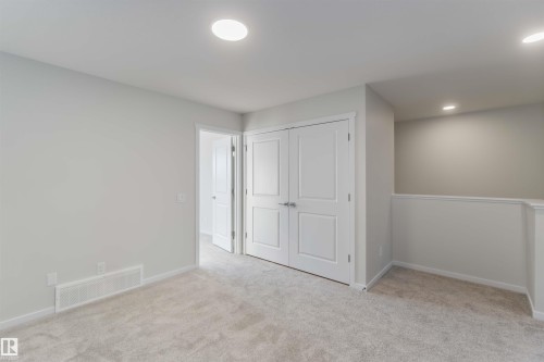 Unfurnished bedroom with light carpet, a closet, and recessed lighting - 262 Chappelle Drive, Edmonton, AB - Indoor Photo Showing Other Room
