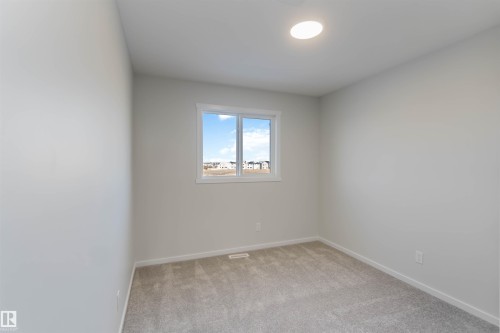 Spare room with light carpet and baseboards - 262 Chappelle Drive, Edmonton, AB - Indoor Photo Showing Other Room