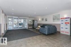 Community lobby with recessed lighting and a textured ceiling - 