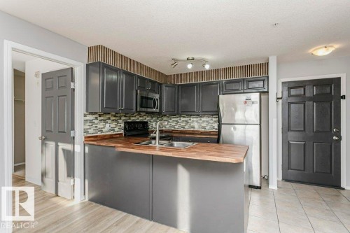 103 4309 33 Street, Stony Plain, AB - Indoor Photo Showing Kitchen With Double Sink