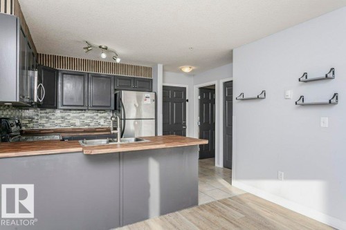 103 4309 33 Street, Stony Plain, AB - Indoor Photo Showing Kitchen With Double Sink