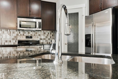6963 19A Avenue, Edmonton, AB - Indoor Photo Showing Kitchen With Double Sink With Upgraded Kitchen