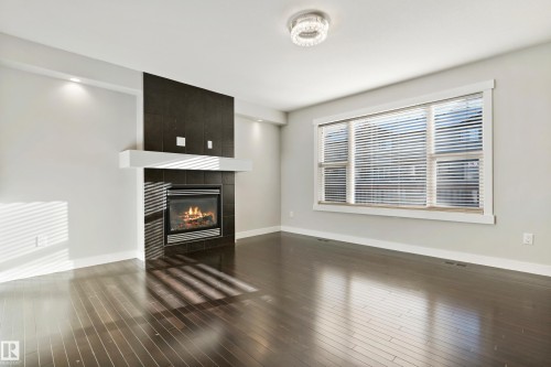 6963 19A Avenue, Edmonton, AB - Indoor Photo Showing Living Room With Fireplace