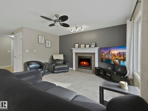 1715 Melrose Crescent, Edmonton, AB - Indoor Photo Showing Living Room With Fireplace