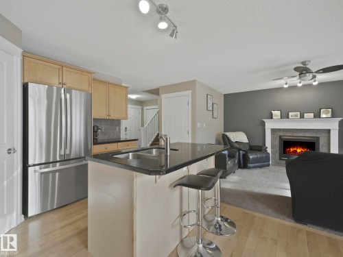 1715 Melrose Crescent, Edmonton, AB - Indoor Photo Showing Kitchen With Fireplace With Double Sink