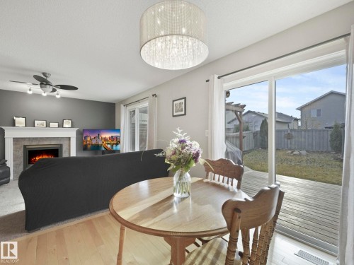 1715 Melrose Crescent, Edmonton, AB - Indoor Photo Showing Dining Room With Fireplace