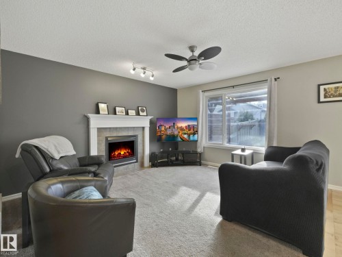 1715 Melrose Crescent, Edmonton, AB - Indoor Photo Showing Living Room With Fireplace