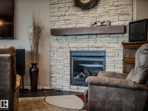 172 Mcdowell Wynd, Leduc, AB - Indoor Photo Showing Living Room With Fireplace