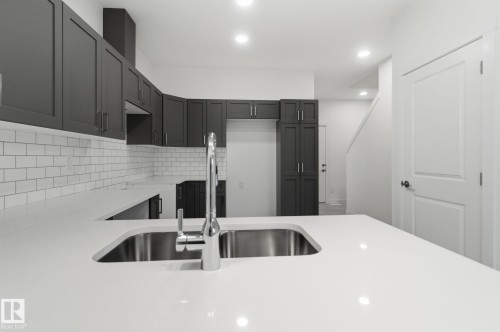 7 2710 66 St, Edmonton, AB - Indoor Photo Showing Kitchen With Double Sink