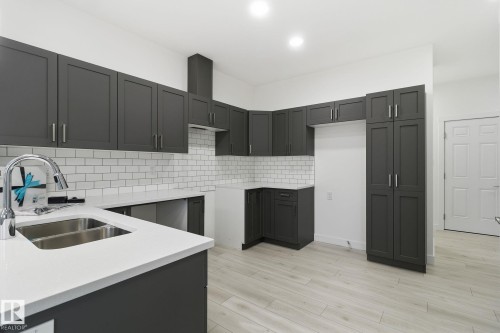 7 2710 66 St, Edmonton, AB - Indoor Photo Showing Kitchen With Double Sink