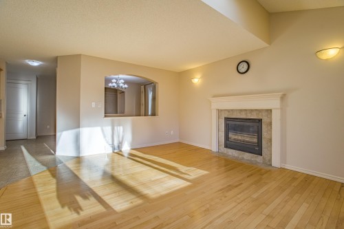 1253 Latta Crescent, Edmonton, AB - Indoor Photo Showing Other Room With Fireplace