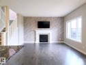 16707 18 Avenue, Edmonton, AB  - Indoor Photo Showing Living Room With Fireplace 
