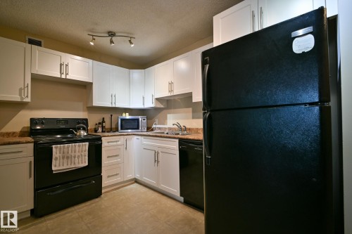 802 9710 105 Street, Edmonton, AB - Indoor Photo Showing Kitchen With Double Sink