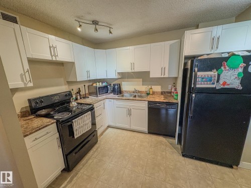 802 9710 105 Street, Edmonton, AB - Indoor Photo Showing Kitchen With Double Sink