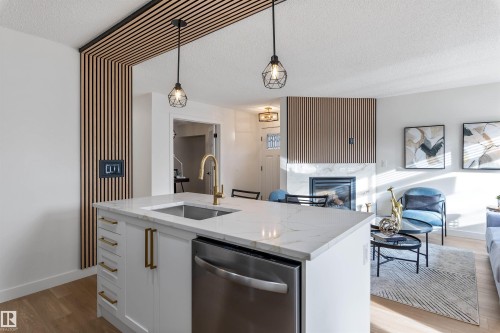 106 81 Garden Road, St. Albert, AB - Indoor Photo Showing Kitchen With Fireplace