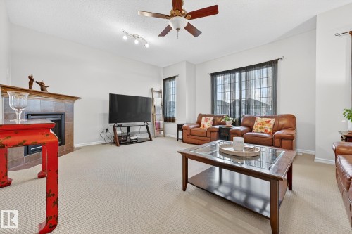 46 Snowbird Crescent, Leduc, AB - Indoor Photo Showing Living Room With Fireplace