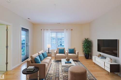 409 160 Magrath Road, Edmonton, AB - Indoor Photo Showing Living Room