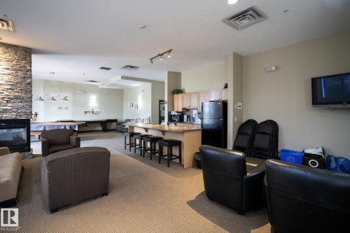 409 160 Magrath Road, Edmonton, AB - Indoor With Fireplace