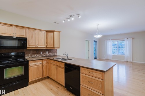 409 160 Magrath Road, Edmonton, AB - Indoor Photo Showing Kitchen With Double Sink