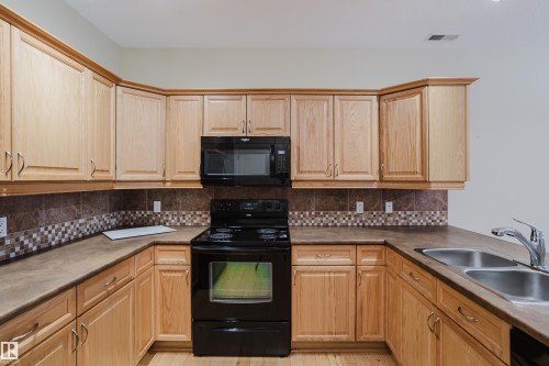 409 160 Magrath Road, Edmonton, AB - Indoor Photo Showing Kitchen With Double Sink