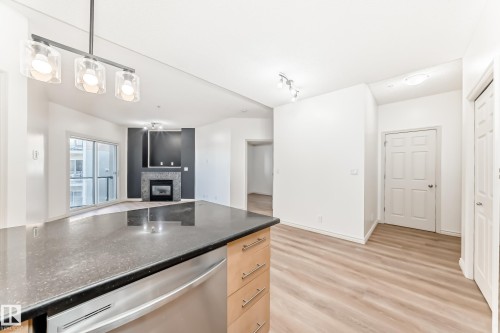 517 10235 112 Street, Edmonton, AB - Indoor Photo Showing Kitchen With Fireplace