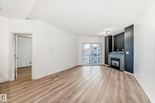 517 10235 112 Street, Edmonton, AB - Indoor Photo Showing Living Room With Fireplace