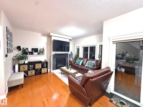 7 13215 153 Avenue, Edmonton, AB - Indoor Photo Showing Living Room With Fireplace