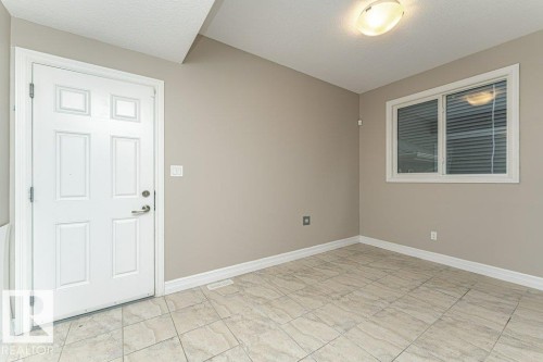 Spare room featuring a textured ceiling and baseboards - 3198 Winspear Crescent Sw, Edmonton, AB - Indoor Photo Showing Other Room