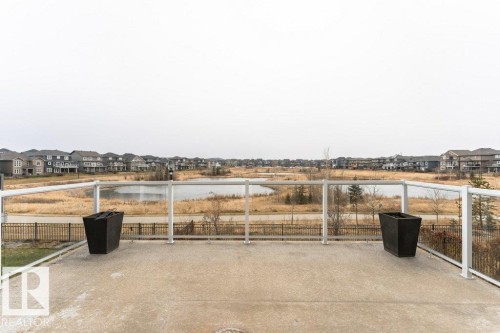 View of patio / terrace featuring a water view and a residential view - 3198 Winspear Crescent Sw, Edmonton, AB - Outdoor With View