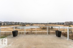 View of patio / terrace featuring a water view and a residential view - 