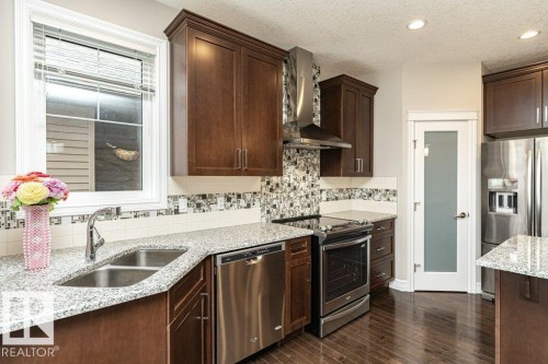 3198 Winspear Crescent Sw, Edmonton, AB - Indoor Photo Showing Kitchen With Stainless Steel Kitchen With Double Sink With Upgraded Kitchen