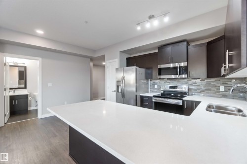 410 560 Griesbach Parade Parade, Edmonton, AB - Indoor Photo Showing Kitchen With Double Sink With Upgraded Kitchen
