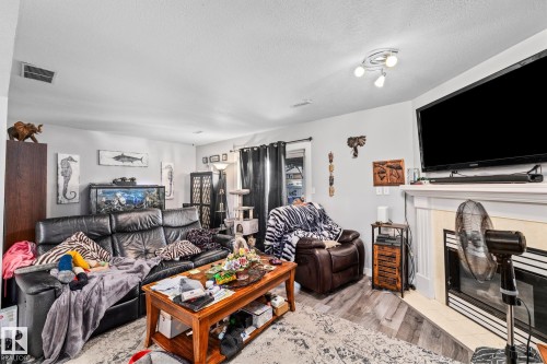 329 River Point, Edmonton, AB - Indoor Photo Showing Living Room With Fireplace