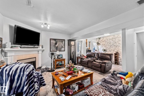 329 River Point, Edmonton, AB - Indoor Photo Showing Living Room With Fireplace