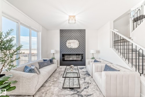 61 Patriot Way, Spruce Grove, AB - Indoor Photo Showing Living Room With Fireplace