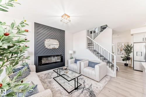 61 Patriot Way, Spruce Grove, AB - Indoor Photo Showing Living Room With Fireplace
