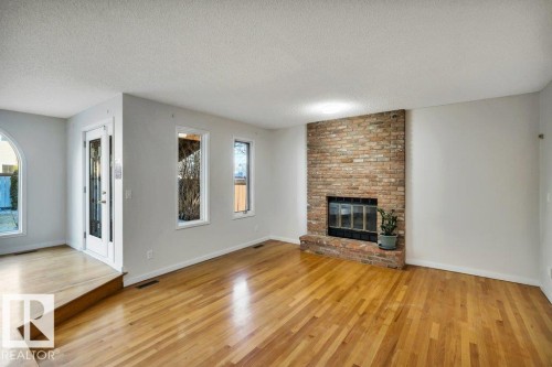 706 Burley Drive, Edmonton, AB - Indoor Photo Showing Living Room With Fireplace