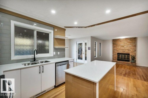 706 Burley Drive, Edmonton, AB - Indoor Photo Showing Kitchen With Fireplace With Double Sink