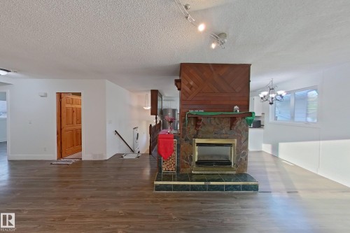 1036 38 Street, Edmonton, AB - Indoor Photo Showing Living Room With Fireplace