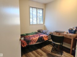 Bedroom featuring wood finished floors - 