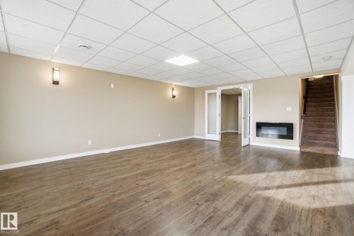 59 Selkirk Place, Leduc, AB - Indoor Photo Showing Other Room With Fireplace