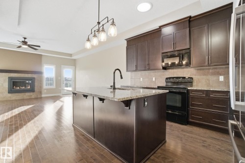 59 Selkirk Place, Leduc, AB - Indoor Photo Showing Kitchen With Upgraded Kitchen