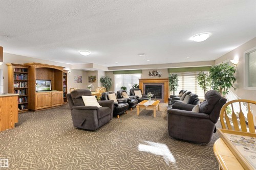 112 237 Youville Drive E, Edmonton, AB - Indoor Photo Showing Living Room With Fireplace