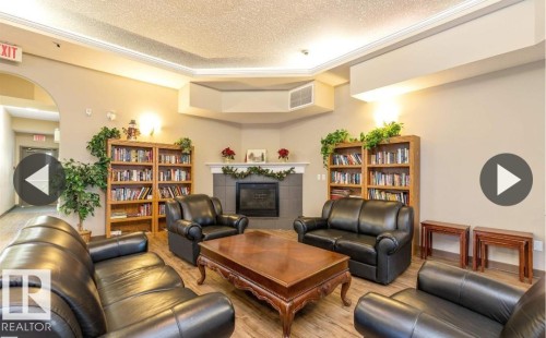 112 237 Youville Drive E, Edmonton, AB - Indoor Photo Showing Living Room With Fireplace