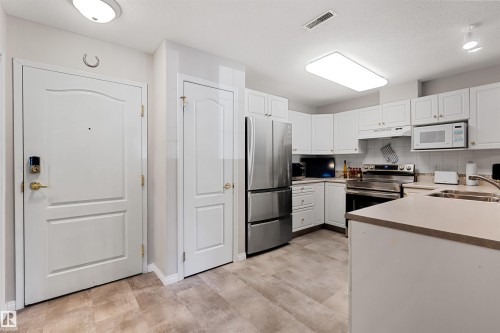 112 237 Youville Drive E, Edmonton, AB - Indoor Photo Showing Kitchen With Double Sink