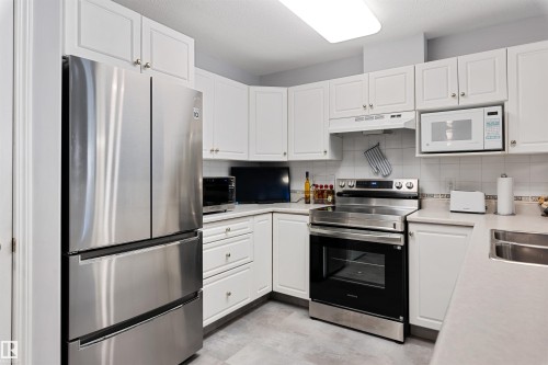 112 237 Youville Drive E, Edmonton, AB - Indoor Photo Showing Kitchen With Double Sink
