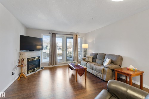 112 237 Youville Drive E, Edmonton, AB - Indoor Photo Showing Living Room With Fireplace