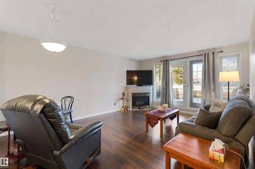 112 237 Youville Drive E, Edmonton, AB - Indoor Photo Showing Living Room With Fireplace